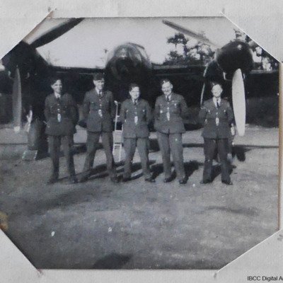 Five airmen in front of a Mosquito